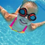 Young girl swimming underwater