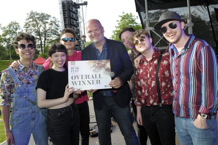Save the Date BuskFest is Back! BuskFest 2019 Best Overall Winner Anna’s Number were joined by judge and compere, BBC Radio Ulster’s Ralph McLean at last year’s awards ceremony before they play a well-deserved encore to a packed Solitude Park.