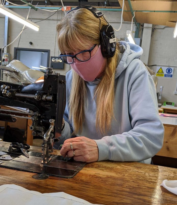 Employee at Ferguson’s Irish Linen making face masks in the company’s Banbridge factory. Employee at Ferguson’s Irish Linen making face masks in the company’s Banbridge factory.