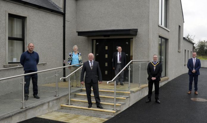 006 ©EBP ST JOHNS COMM HALL_EBS0513 Five men and one woman pictured outside a newly renovated community hub.