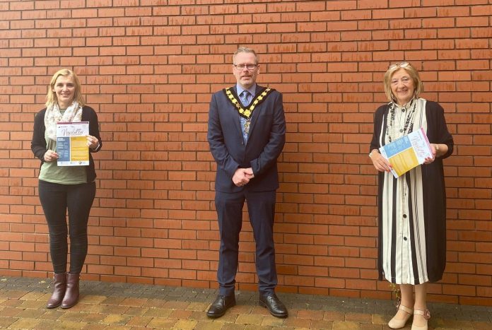 Positive Ageing Month - Newsletter Lord Mayor and representatives holding the newsletter