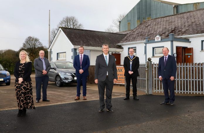 Redrock Five men and one woman pictured outside a building