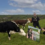 The photo shows the Lord Mayor and Deputy Lord Mayor in a field with cows launching the photographic competition.