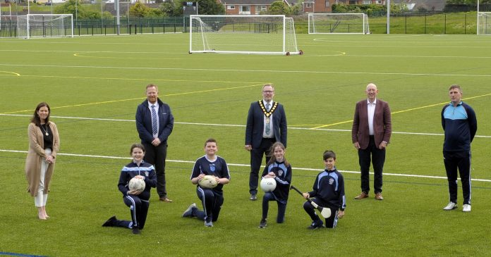 Lord Mayor, Councillor Kevin Savage (centre) is joined by (L-R) Roisin Woods, Principle, St Patrick's College. Councillor Paul Greenfield, Chairperson of the Local PEACE IV Partnership, George Lucas, Sport NI, Tony Kearney, Head of Sport, St Patrick’s College and pupils Chloe, Fionn, Mya and Marc on site at the Community Sports Campus at St Patrick's College.