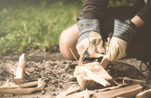 Person cutting up fire wood