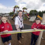 Lord Mayor cuts the ribbon with two pupils to officially open Markethill PLay Park