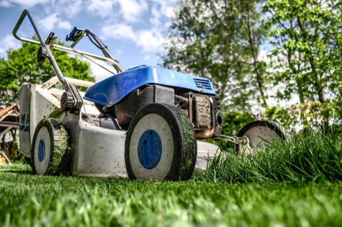 An image of a lawn mower on the grass
