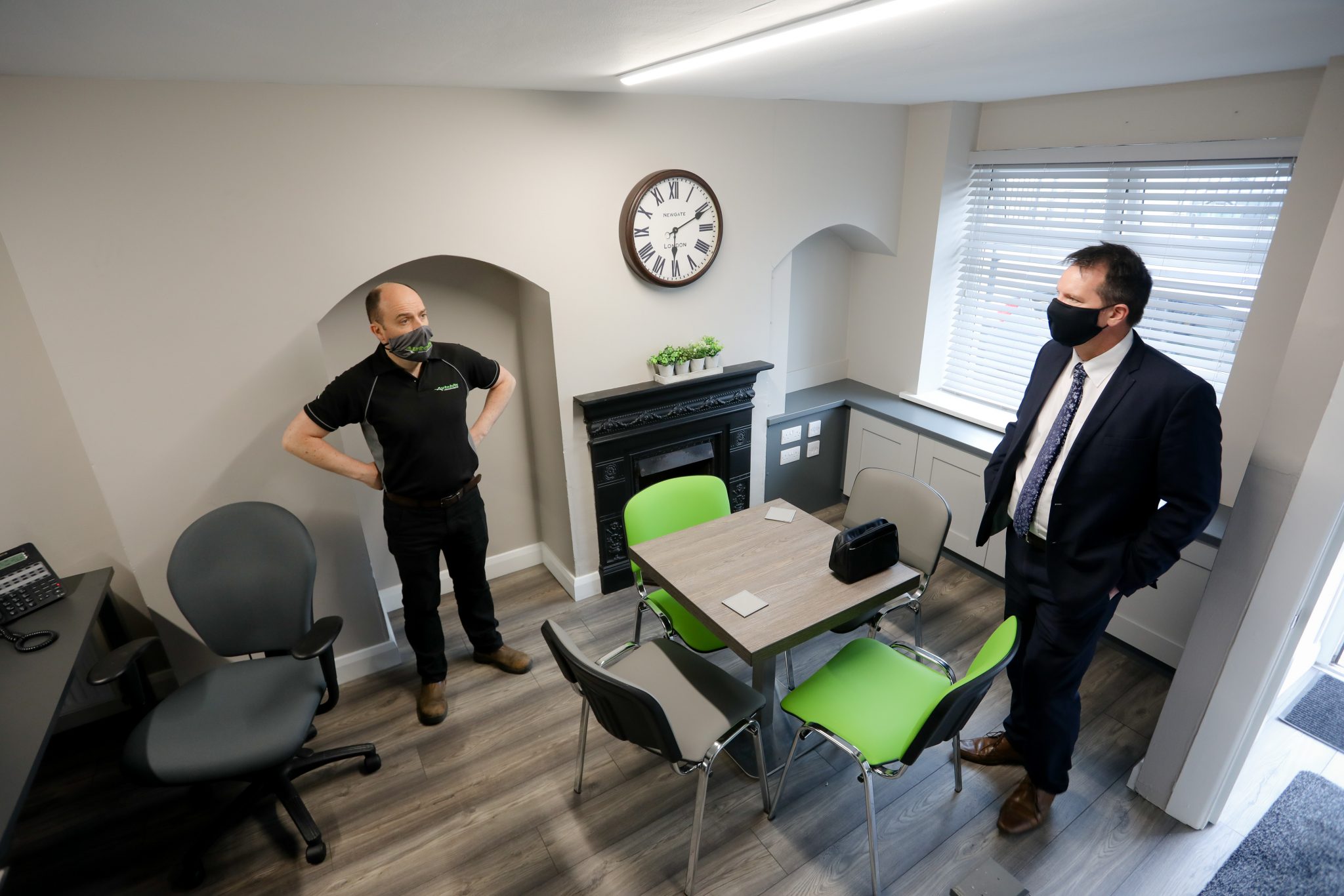 Two males standing indoors