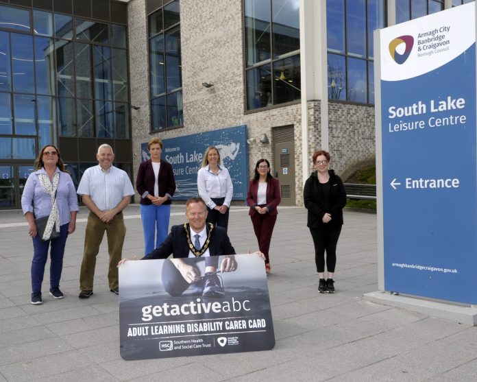 Lord Mayor Councillor Paul Greenfield pictured at South Lake Leisure Centre (SLLC), promoting the Get Active ABC Carer Card with Anna Connolly, SHSCT Children's Disability Services; Mark Irwin, SHSCT Adult Learning Disability Care Consultant; Majella Gorman, SHSCT Adult Learning Disability Care Consultant; Catherine McNeill, SLLC Operations Manager; Bernadette Marshall, SHSCT Adult Learning Disability Care Consultant and Joanne McCracken.