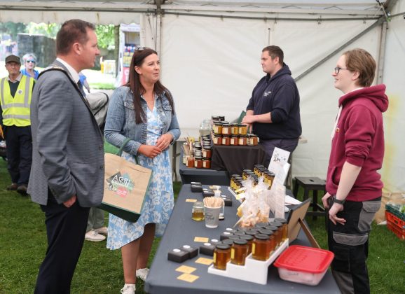 Outgoing Lord Mayor and Lady Mayoress of Armagh City, Banbridge and Craigavon, Alderman Barr with Christine Marshall from Marshall Bee Keeping, who took part in in ABC Council’s Food Heartland Showcase Stand at the 107th Lurgan Show.