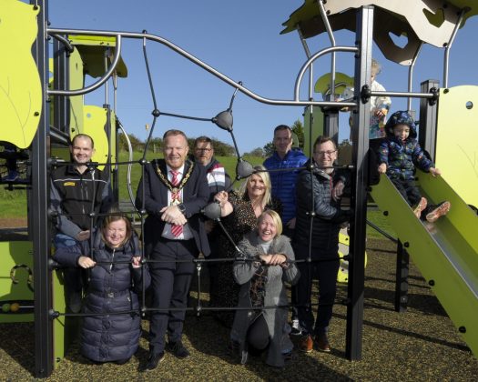 Brian McGivern (Farrans); Gillian Dewart (ABC Council); Lord Mayor, Councillor Paul Greenfield; Bryan Orr (ABC Council); Councillor Jill Macauley; Joan Noade (ABC Council); Gareth Wilson (Farrans) and David Leemon (ABC Council) with children from the Nursery Unit at Drumadonnell PS at opening of newly refurbished Millstone Close Play Park.