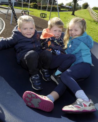 Young children loving the new fun-filled play park at Millstone Close Play Park.