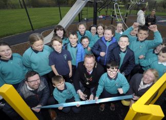 Lord Mayor of Armagh City, Banbridge and Craigavon, Councillor Paul Greenfield cuts the ribbon to officially launch newly refurbished Drumbreda Play Park in Armagh – much to the delight of students from nearby St Patrick’s P.S.