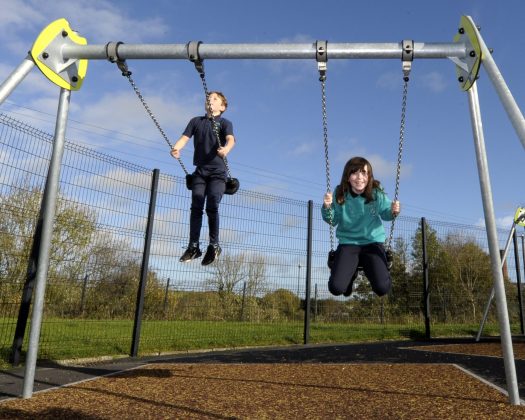 Lord Mayor of Armagh City, Banbridge and Craigavon, Councillor Paul Greenfield cuts the ribbon to officially launch newly refurbished Drumbreda Play Park in Armagh – much to the delight of students from nearby St Patrick’s P.S