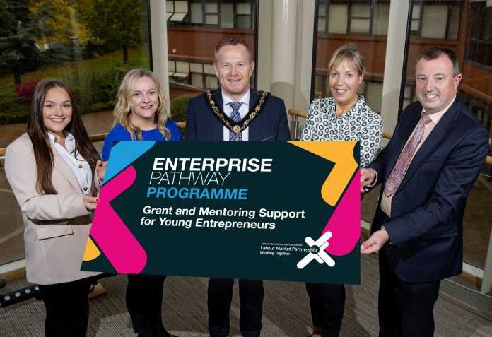 Leah McCann – who took the huge step of opening her own business ‘For You Baby Clothing’ in Lurgan with help from the programme – is pictured alongside Dana McKenna (Armagh Business Centre), Lord Mayor, Councillor Paul Greenfield, Nicola Wilson (ABC Council) and Alderman Ian Burns (Chair of Council’s Economic Development and Regeneration Committee).