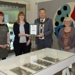 The Lord Mayor and members of staff from FE McWilliam Gallery holding a certificate with 4 stars from Tourism NI