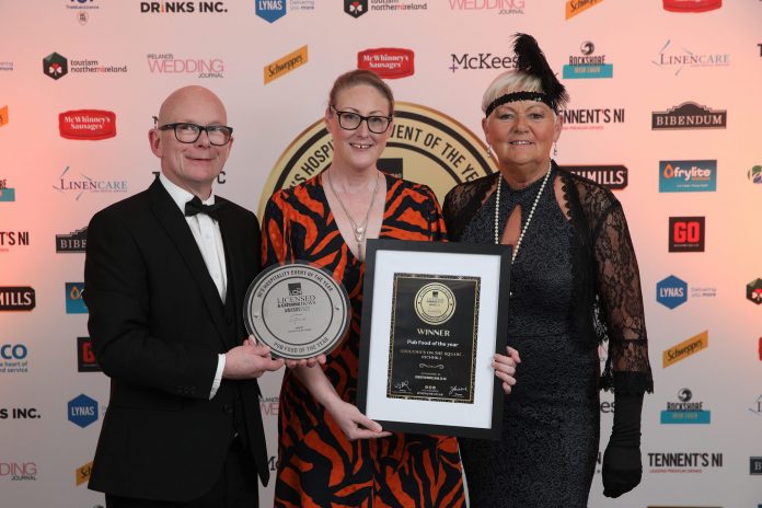 Pub Food Of the Year- Groucho's on the Square Representatives from Groucho's on the Square holding their award presented by Brenda Courtney from the LCN