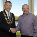 BC Councillor Sam Nicholson, ICBAN Chair for 2022/23 being congratulated by Councillor David Maxwell, Outgoing Chair ICBAN Chair