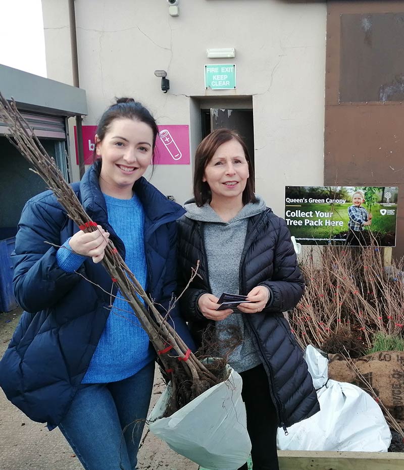 Rita and Clara collecting their tree pack at Fairgreen Recycling Centre Portadown