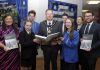 Lord Mayor, Councillor Paul Greenfield and Dolores Donnelly, Community Development Officer present copies of the Great Famine Education Programme booklet to Miss Caitlin Seeley, St. John the Baptist College and Mr Andrew Chambers, Killicomaine Junior High School along with pupils from both schools.