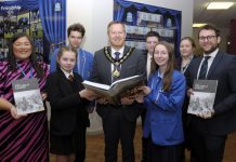 Lord Mayor, Councillor Paul Greenfield and Dolores Donnelly, Community Development Officer present copies of the Great Famine Education Programme booklet to Miss Caitlin Seeley, St. John the Baptist College and Mr Andrew Chambers, Killicomaine Junior High School along with pupils from both schools.