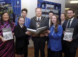 Lord Mayor, Councillor Paul Greenfield and Dolores Donnelly, Community Development Officer present copies of the Great Famine Education Programme booklet to Miss Caitlin Seeley, St. John the Baptist College and Mr Andrew Chambers, Killicomaine Junior High School along with pupils from both schools.