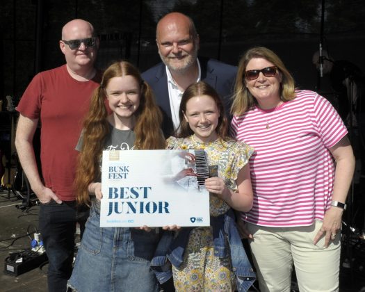 Three adults and two young girls.