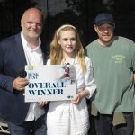 Three people standing outside