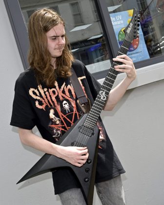 Young male with guitar.
