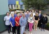 The photo shows a variety of people standing in the new garden at Blossom Children's Ward