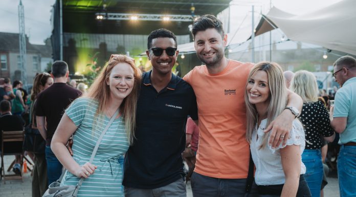 Four friends standing enjoying the atmosphere at Shambles Market