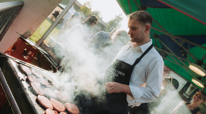 Burgers being cooked outdoors