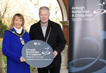 Lord Mayor Alderman Margaret Tinsley and Chair of ABC Sports Forum Cathal O'Neill are holding an ABC Sports Forum sign to encourage sports clubs and individuals to join the forum.