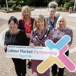 Five women, including Lord Mayor Margaret Tinsley holding a sign for ABC LMP.