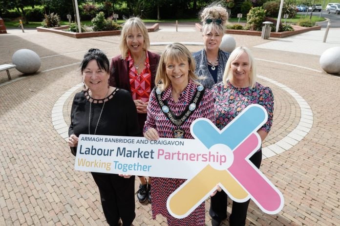 Five women, including Lord Mayor Margaret Tinsley holding a sign for ABC LMP.