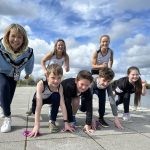 7 people pose in running position