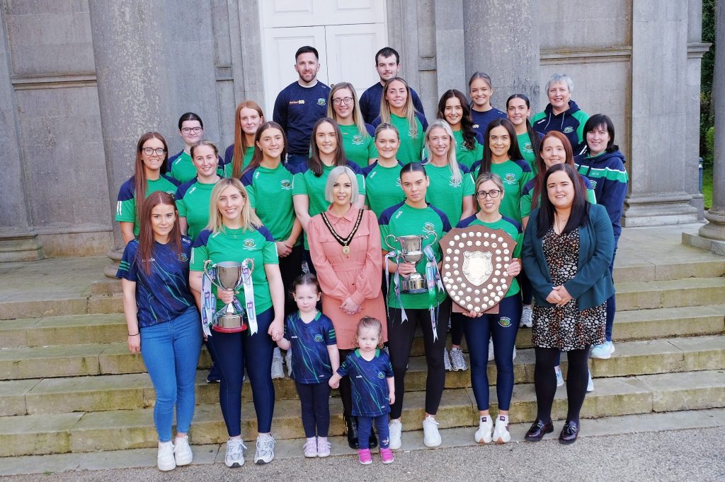 Deputy Lord Mayor, Cllr Sorcha McGeown alongside Granemore Camogie Ladies who won the Senior Club Championship, the Ulster Junior A Championship and the All-Ireland Junior Championship last season.  Also pictured is Cllr Brona Haughey.