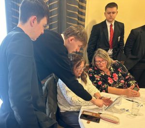 Adults gain new IT skills on their tablet devices from pupils at St Patrick’s Grammar, Armagh.