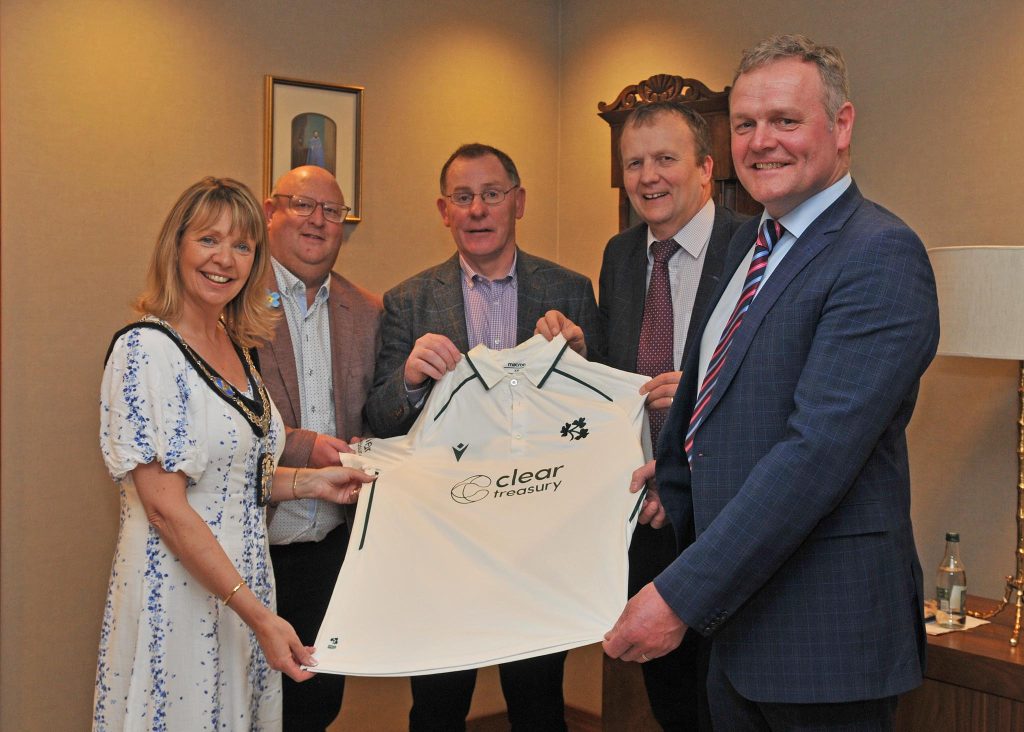 Alan Waite, Chairman of Waringstown Cricket Club, presents an Ireland Cricket Team shirt, worn by Waringstown player Graham Hume in a recent International match to, Lord Mayor of Armagh City, Banbridge and Craigavon, Alderman Margaret Tinsley , Councillor Peter Haire, Councillor Tim McClelland and Councillor Kyle Savage. 