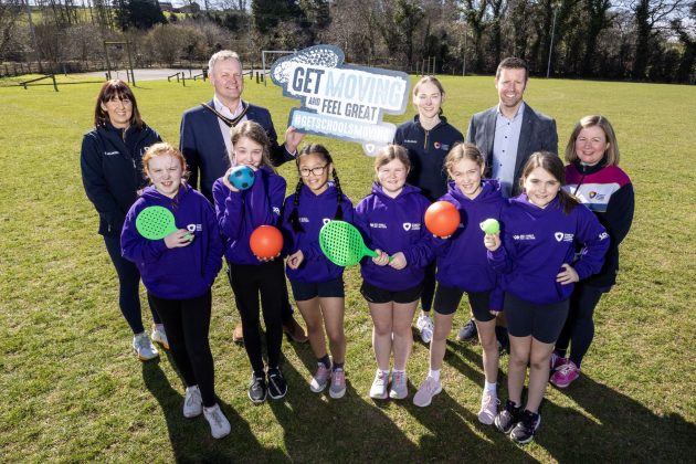 Group of people smiling to promote physical activity for girls.