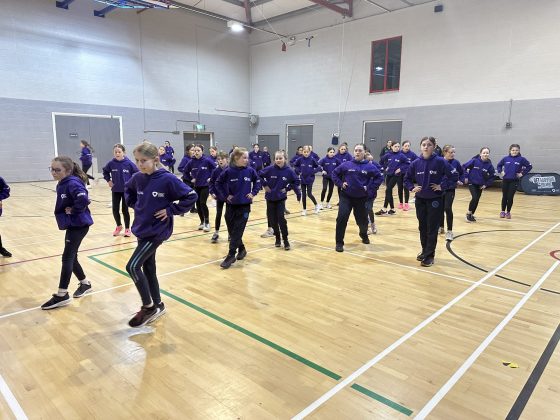 A large group of girls dancing.