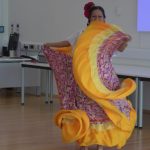 A lady doing a traditional dance.