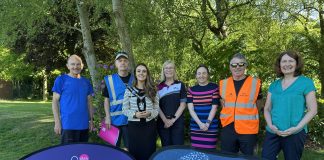 Group of people standing behind signs to promote the new Lurgan Park Parkrun and Get Moving ABC.