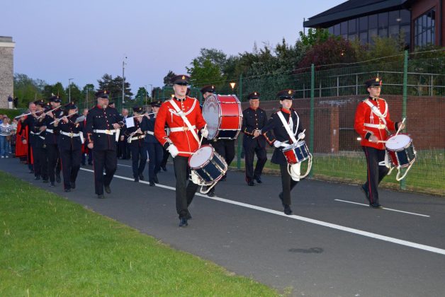 Musical band walking outside.