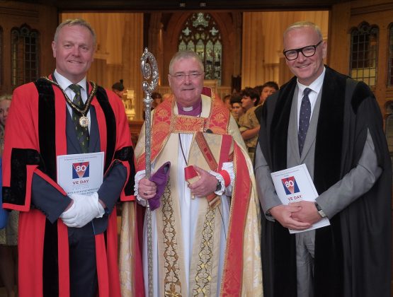 Three men standing.
