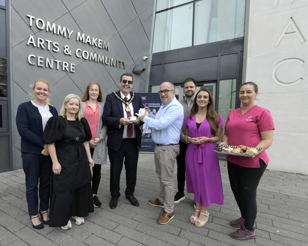 A group of people standing outside the TMAC Centre in Keady to mark the launch of the new social enterprise cafe The Gathering Rooms