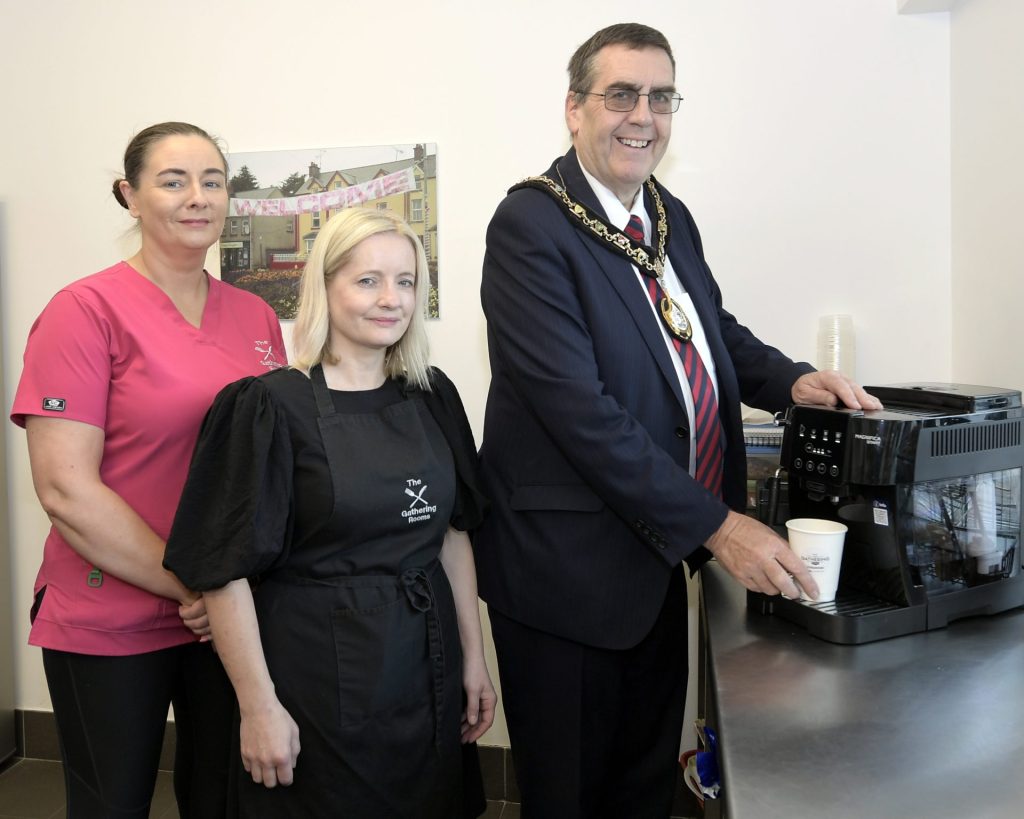 3 people pictured in the kitchen of TMAC Centre