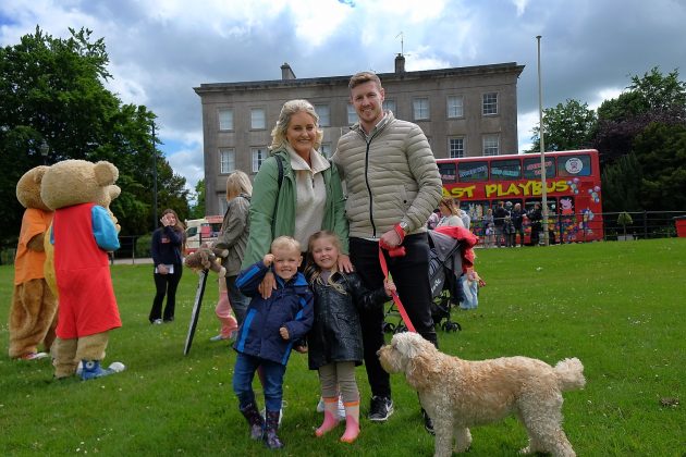 Family of four with dog