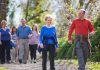 A small group of adults walking through the countryside.