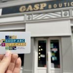 Shop ABC Gift Card now accepted at over 180 businesses across the borough A hand holding a Shop ABC Gift Card outside Gasp Boutique